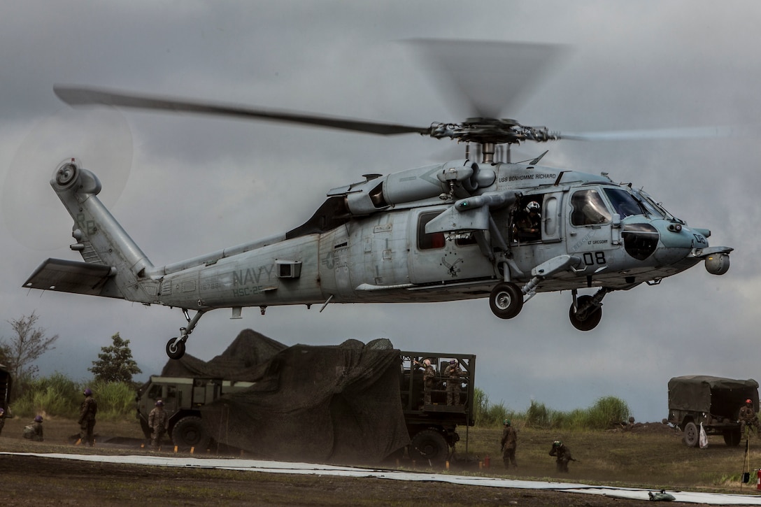 A Sikorsky MH-60S Seahawk with Helicopter Sea Combat Squadron (HSC) 25 comes in for a landing during Exercise Eagle Wrath 2016 at Combined Arms Training Center Camp Fuji, Japan, July 28, 2016. HSC-25 is home-based at Anderson Air Force Base, Guam, and detached to Naval Air Facility Atsugi, United States Ship Bonhomme Richard (LHD-6). Marine Wing Support Squadron 171 stationed at Marine Corps Air Station Iwakuni, received assistance throughout the exercise from Combat Logistics Company 36 from MCAS Iwakuni, the Low Altitude Air Defense Battalion and Marine Air Traffic Control Mobile Team from the 31st Marine Expeditionary Unit and HSC-25. (U.S. Marine Corps photo by Lance Cpl. Aaron Henson)
