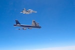 A Canadian CF-18 fighter jet intercepts a B-52 Stratofortress from the 2nd Bomb Wing, Barksdale Air Force Base, La., over the Atlantic in support of POLAR ROAR, Aug. 1, 2016. The B-52 flew non-stop from the U.S. to the Baltic Sea and back to conduct the intercept training with NORAD-assigned Canadian fighter aircraft and NATO allies. In total, three B-52s and two B-2 Spirit bombers from all three of the U.S.â€™s strategic bomber bases (Barksdale AFB, La.; Minot AFB, N.D.; and Whiteman AFB, Mo.) participated in POLAR ROAR, which also included flights to the Arctic and Alaska's Aleutian Islands.  Strategic bomber missions like POLAR ROAR ensure crews maintain the readiness and proficiency necessary to provide an always-ready global strike capability. (Photo courtesy of Canadian NORAD Region)