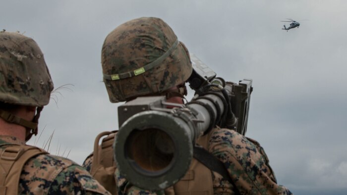 U.S. Marine Corps Cpl. Johnston Murn, a low altitude air defense gunner with 3rd LAAD Battalion unit deployment program, uses a Stinger missile tracking and handling trainer on a Sikorsky MH-60S Seahawk with Helicopter Sea Combat Squadron 25 during Exercise Eagle Wrath 2016 at Combined Arms Training Center Camp Fuji,Japan, July 28, 2016. Marine Wing Support Squadron 171 stationed at Marine Corps Air Station Iwakuni, Japan, received assistance throughout the exercise from Combat Logistics Company 36 from MCAS Iwakuni, the Low Altitude Air Defense Battalion and Marine Air Traffic Control Mobile Team from the 31st Marine Expeditionary Unit and HSC-25 from Andersen Air Force Base, Guam. 