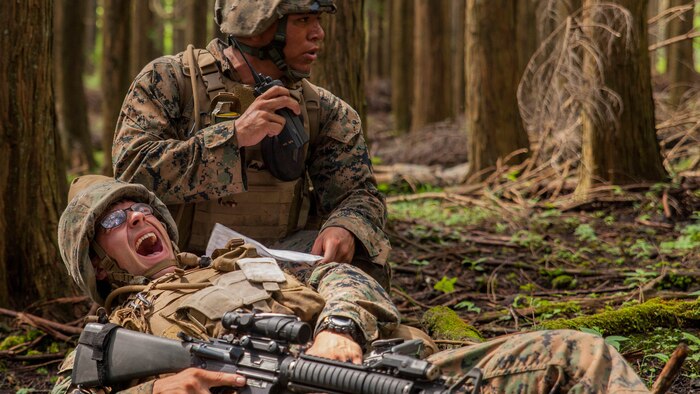 U.S. Marine Corps Cpl. Christian Marin, a heavy equipment mechanic with Marine Wing Support Squadron 171 stationed at Marine Corps Air Station Iwakuni, Japan, radios-in a simulated casualty during Exercise Eagle Wrath 2016 at Combined Arms Training Center Camp Fuji,Japan, July 28, 2016. During the culminating event, Marines established a mock air base including a landing zone and refueling point, constructed defensive and machine-gun positions, and conducted convoys and patrols over the course of four days. MWSS-171 conducts this exercise once a year in order to train all the Marines within the squadron, enhance their technical skills, field experience and military occupational specialty capability.