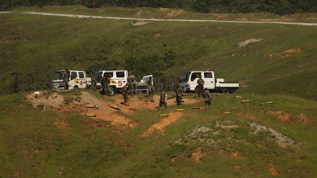 Marines place artillery rounds on the hillside of a range in preparation for standoff munitions training, July 28, 2016, at Marine Corps Base Camp Schwab, Okinawa, Japan. The artillery rounds served as explosive targets for explosive ordnance disposal technicians and reconnaissance Marines who participated in the drill. The training ensured EOD technicians were proficient in the safe long-distance detonation of explosives, using the SASR-M107 sniper rifle. The EOD technicians are with Headquarters and Support Battalion, Marine Corps Installations Pacific-Marine Corps Base Camp Butler, Japan and Marine Wing Support Squadron 172, Marine Aircraft Group 36, 1st Marine Aircraft Wing, III Marine Expeditionary Force. The reconnaissance Marines are with 3rd Reconnaissance Battalion, 3rd Marine Division, III MEF.