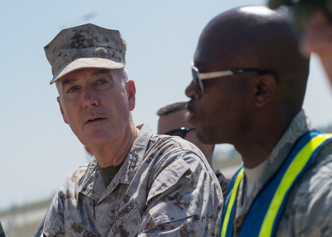 Marine Corps Gen. Joe Dunford, chairman of the Joint Chiefs of Staff, listens to Air Force Master Sgt. Gaston brief him as he observes airmen participating in a field exercise at Incirlik Air Base, Turkey, Aug. 2, 2016. DoD photo by Navy Petty Officer 2nd Class Dominique A. Pineiro