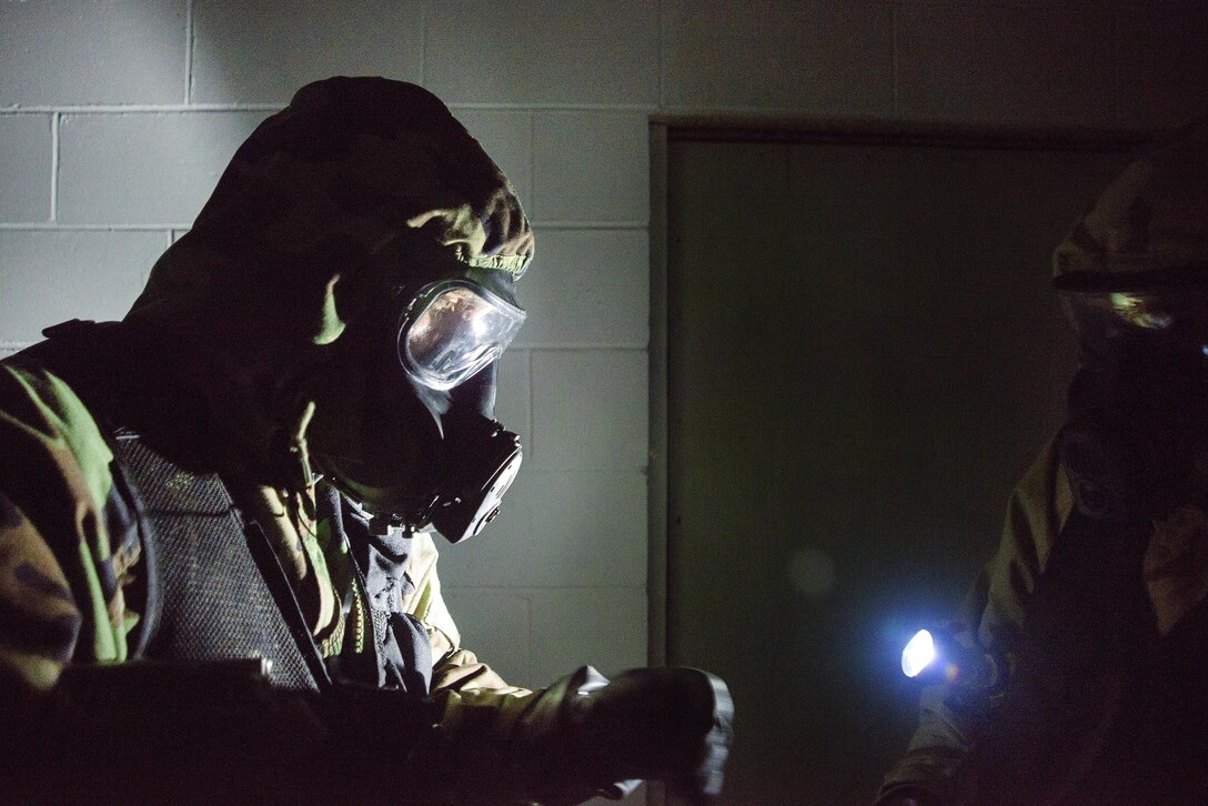 Army Sgts. Jhustin Welch, left, and Justin Scott scan a bunker using a device to detect hazardous materials and radiation during Vigilant Guard 2016, an exercise at Camp Johnson, Vt., July 27, 2016. Welch and Scott are assigned to the Maine Army National Guard’s 11th Civil Support Team. Air National Guard photo by Airman 1st Class Jeffrey Tatro