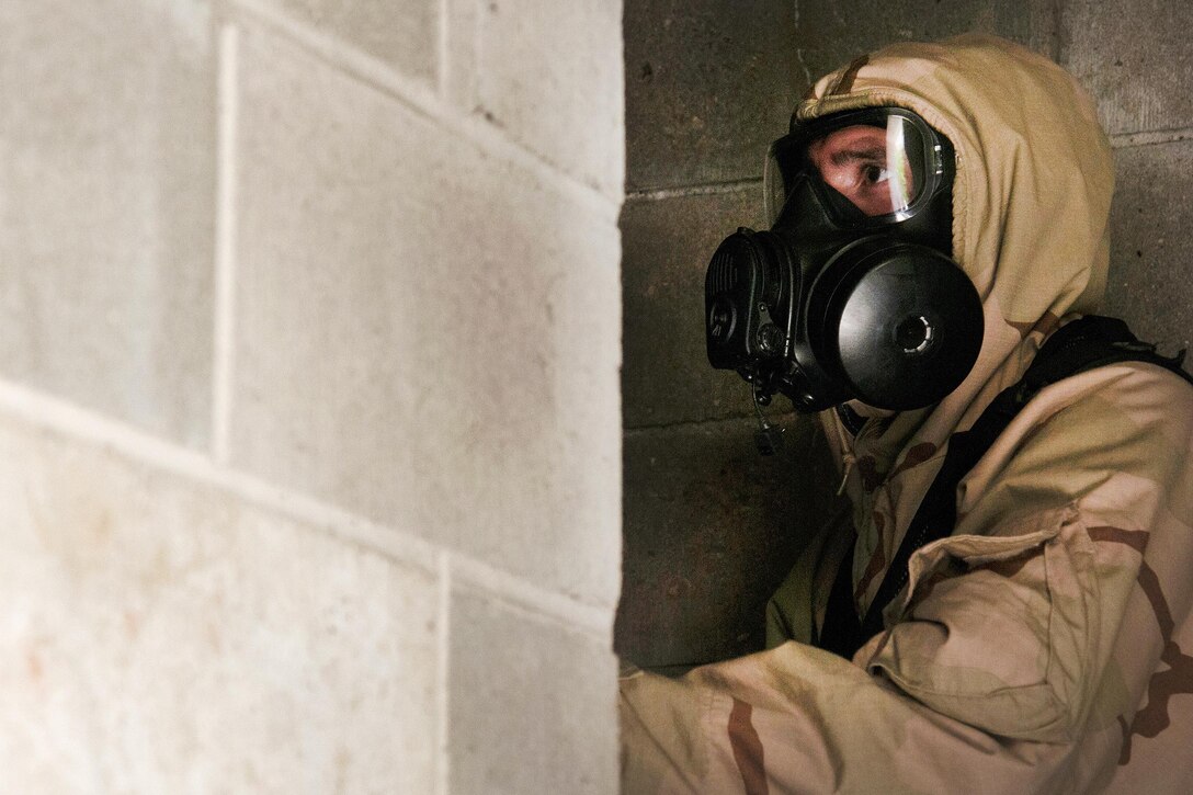 Army Sgt. Justin Scott prepares to enter a bunker during Vigilant Guard 2016, an exercise at Camp Johnson, Vt., July 27, 2016. Scott is assigned to the Maine Army National Guard’s 11th Civil Support Team. The National Guard and U.S. Northern Command sponsor the emergency response exercise, which provides an opportunity for service members to improve cooperation with civilian, military and federal partners as they prepare for emergencies and catastrophic events. Air National Guard photo by Tech. Sgt. Chelsea Clark