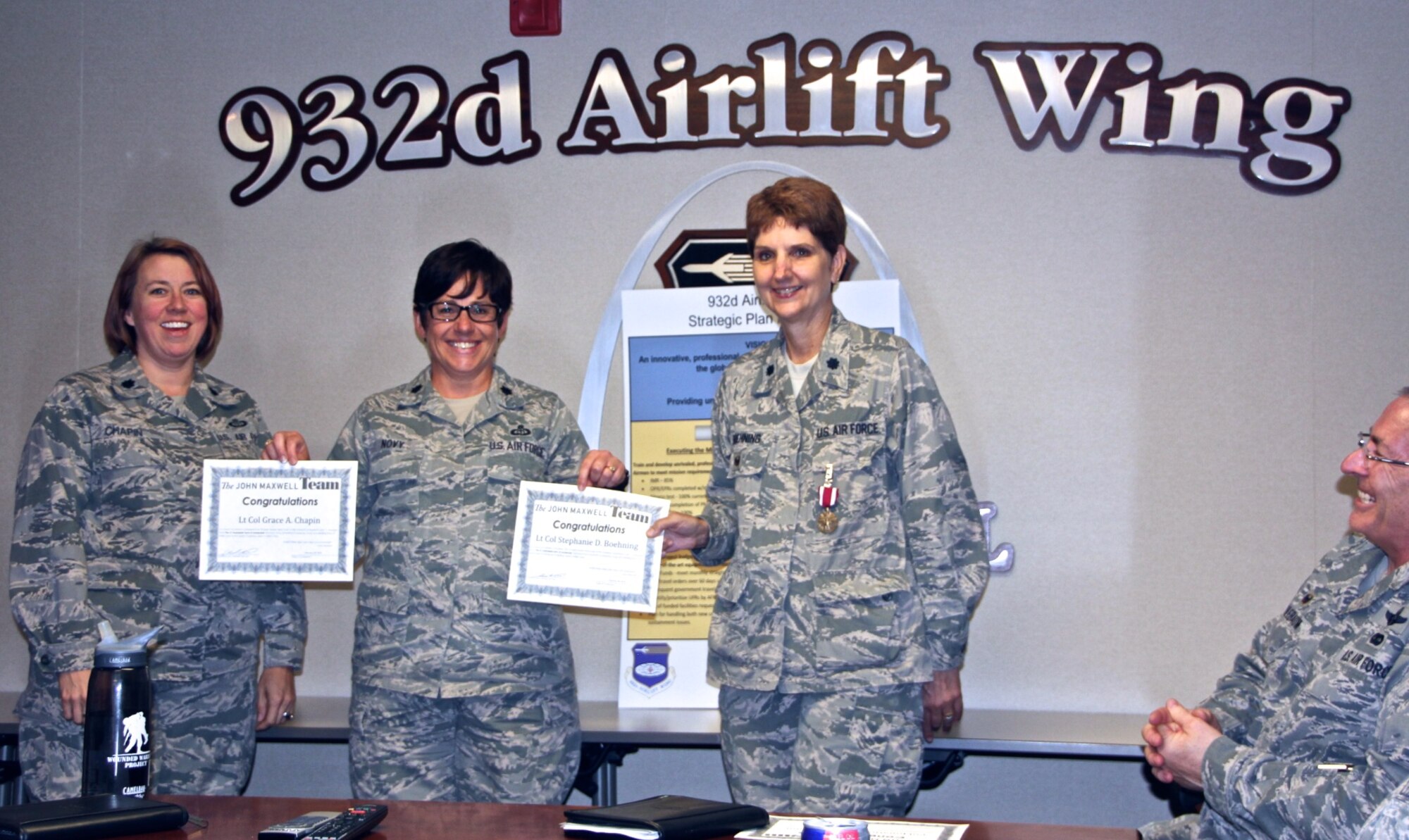 Graduation certificates were presented by the 932nd Director of Staff, Lt. Col. Julie Novy (center), to Lt. Col. Grace Chapin (left), and to Lt. Col. Stephanie Boehning (right), who recently went through this Advanced Leadership Certification Program to become part of the John C. Maxwell Team, a program which focuses on achieving potential, inspiring and motivating others through mutual respect, and creating influence.  The course helps others leading teams, coaching through personnel issues, and getting positive results now and in the future.  (U.S. Air Force photo by Maj. Stan Paregien)