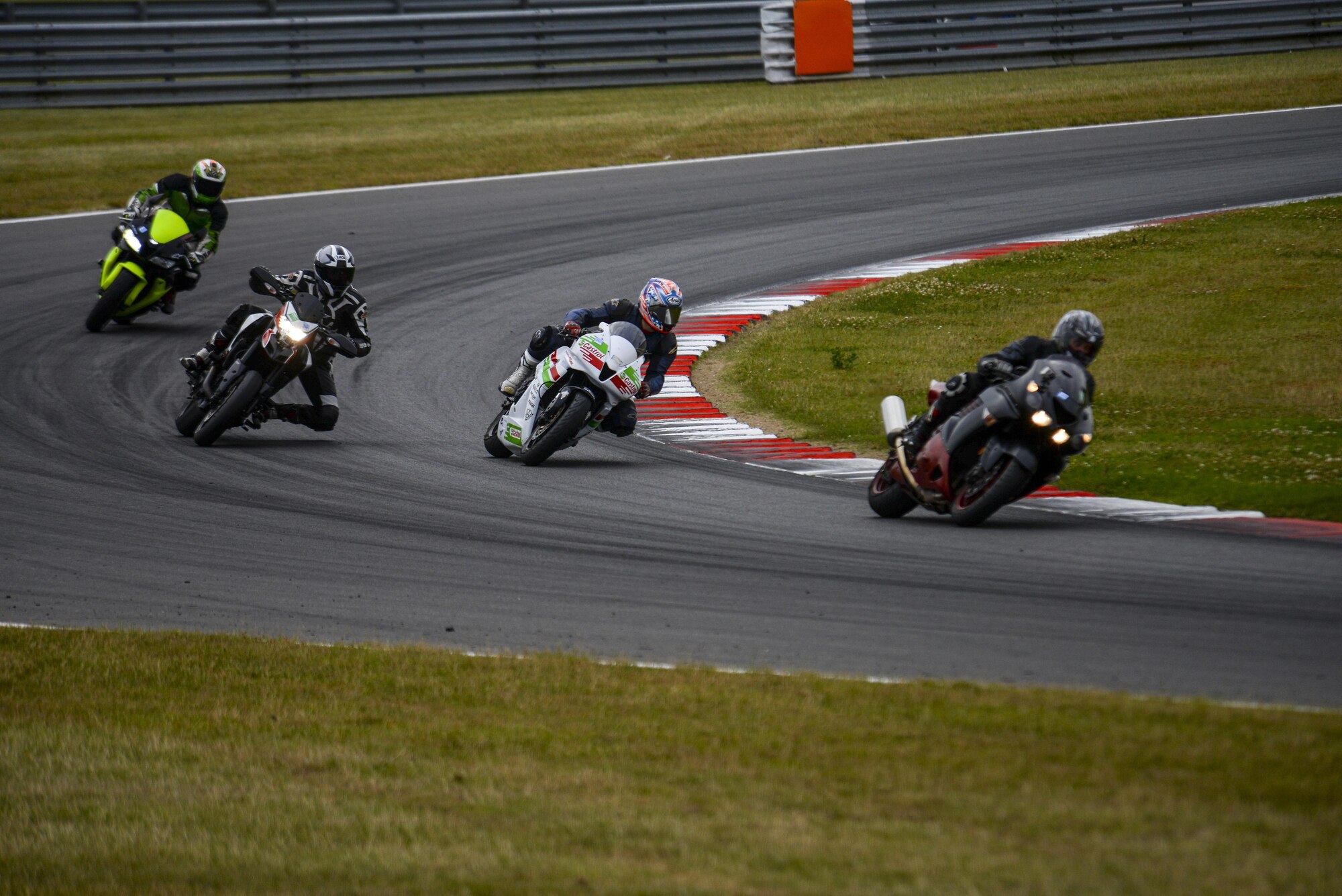 Participants in the Military Track Day exit a corner July 26, 2016, at Snetterton Circuit in Norwich, England. The track day was coordinated to boost rider confidence and skill. (U.S. Air Force photo by Staff Sgt. Micaiah Anthony)