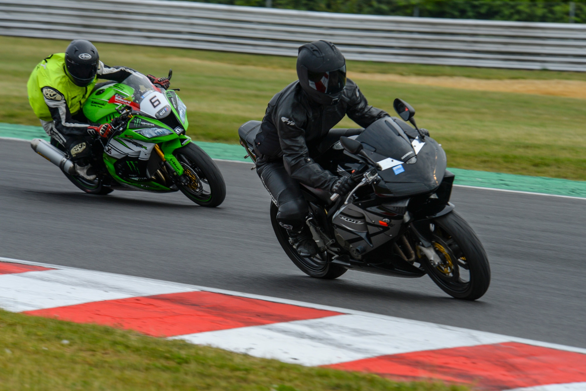 Participants in the Military Track Day enter a corner July 26, 2016, at Snetterton Circuit in Norwich, England. The track day was coordinated to boost rider confidence and skill. (U.S. Air Force photo by Staff Sgt. Micaiah Anthony)