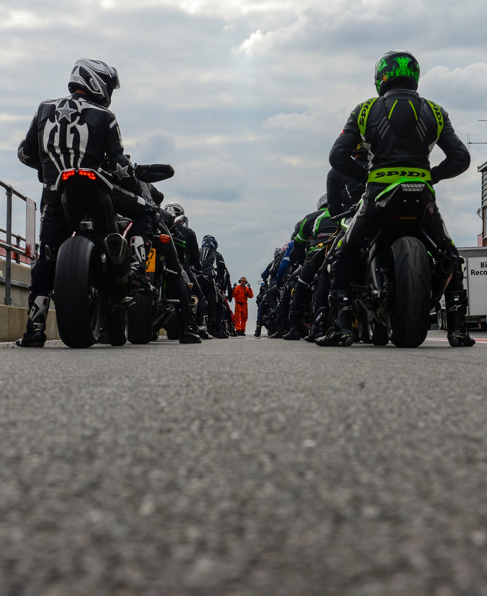 Participants in the Military Track Day prepare to leave the pit area July 26, 2016, at Snetterton Circuit in Norwich, England. The two groups alternated every 15 minutes to give riders time to make repairs, rest and refuel. (U.S. Air Force photo by Staff Sgt. Micaiah Anthony)