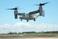 An MV-22B Osprey equipped with a 3-D printed titanium link and fitting inside an engine nacelle maintains a hover as part of a July 29 demonstration at Patuxent River Naval Air Station, Maryland. The flight marked Naval Air System Command’s first successful flight demonstration of a flight critical aircraft component built using additive manufacturing techniques. (U.S. Navy photo)