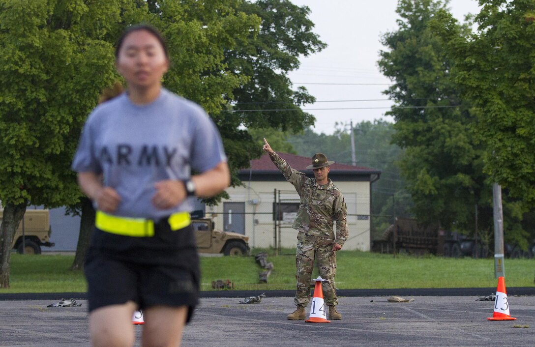 Army Reserve drill sergeants from Task Force Wolf grade Cadets performing the aerobic interval run for the Occupational Physical Assessment Test (OPAT) at U.S. Army Cadet Command during Cadet Summer Training (CST16), Ft. Knox, Kentucky, July 25. (U.S. Army Reserve photo by Sgt. Karen Sampson/ Released)