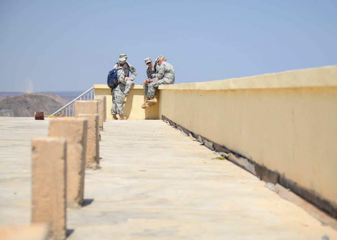 A group of U.S. Army Reserve Officer Training Corps cadets talks during a break at the Djiboutian Army Academy in Arta, Djibouti, July 25, 2016. The cadets are spending three weeks with the Djiboutian Army in a culture exchange program, where they are learning each other’s language and methods of military operations. (U.S. Air Force photo by Staff Sgt. Benjamin Raughton/Released)