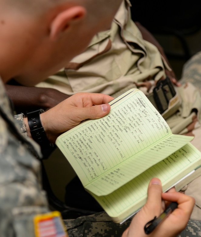 Michael Moser, a U.S. Army Reserve Officer Training Corps cadet from Seattle University, reviews vocabulary words learned during a language exchange program at the Djiboutian Military Academy at Arta, Djibouti, July 25, 2016. The cadets are spending three weeks with the Djiboutian Army in a culture exchange program, where they are learning each other’s language and methods of military operations. (U.S. Air Force photo by Staff Sgt. Benjamin Raughton/Released)