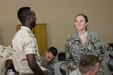 Katherine Wilson, a U.S. Army Reserve Officer Training Corps cadet from Seton Hall University, talks to a Djiboutian Army cadet during a language exchange at the Djiboutian Military Academy at Arta, July 25, 2016. The cadets are spending three weeks with the Djiboutian Army in a culture exchange program, where they are learning each other’s language and methods of military operations. (U.S. Air Force photo by Staff Sgt. Benjamin Raughton/Released)