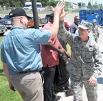 Brig. Gen. Bob LaBrutta (right), 502nd Air Base Wing and Joint Base San Antonio commander, greets a civilian June 3, 2013 during a tour of JBSA-Fort Sam Houston.
