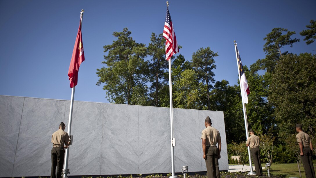 U.S. service members and guests attend the Montford Point Marine Memorial dedication ceremony held at Jacksonville, North Carolina, July 29, 2016. The memorial was built in honor of the 20,000 African-Americans who attended training at Montford Point. 