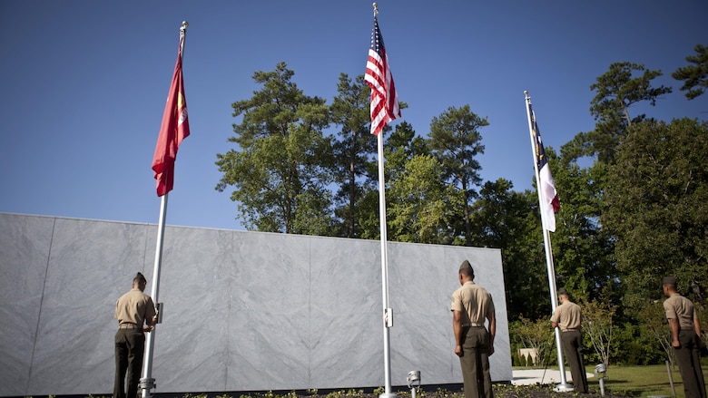 U.S. service members and guests attend the Montford Point Marine Memorial dedication ceremony held at Jacksonville, North Carolina, July 29, 2016. The memorial was built in honor of the 20,000 African-Americans who attended training at Montford Point. 