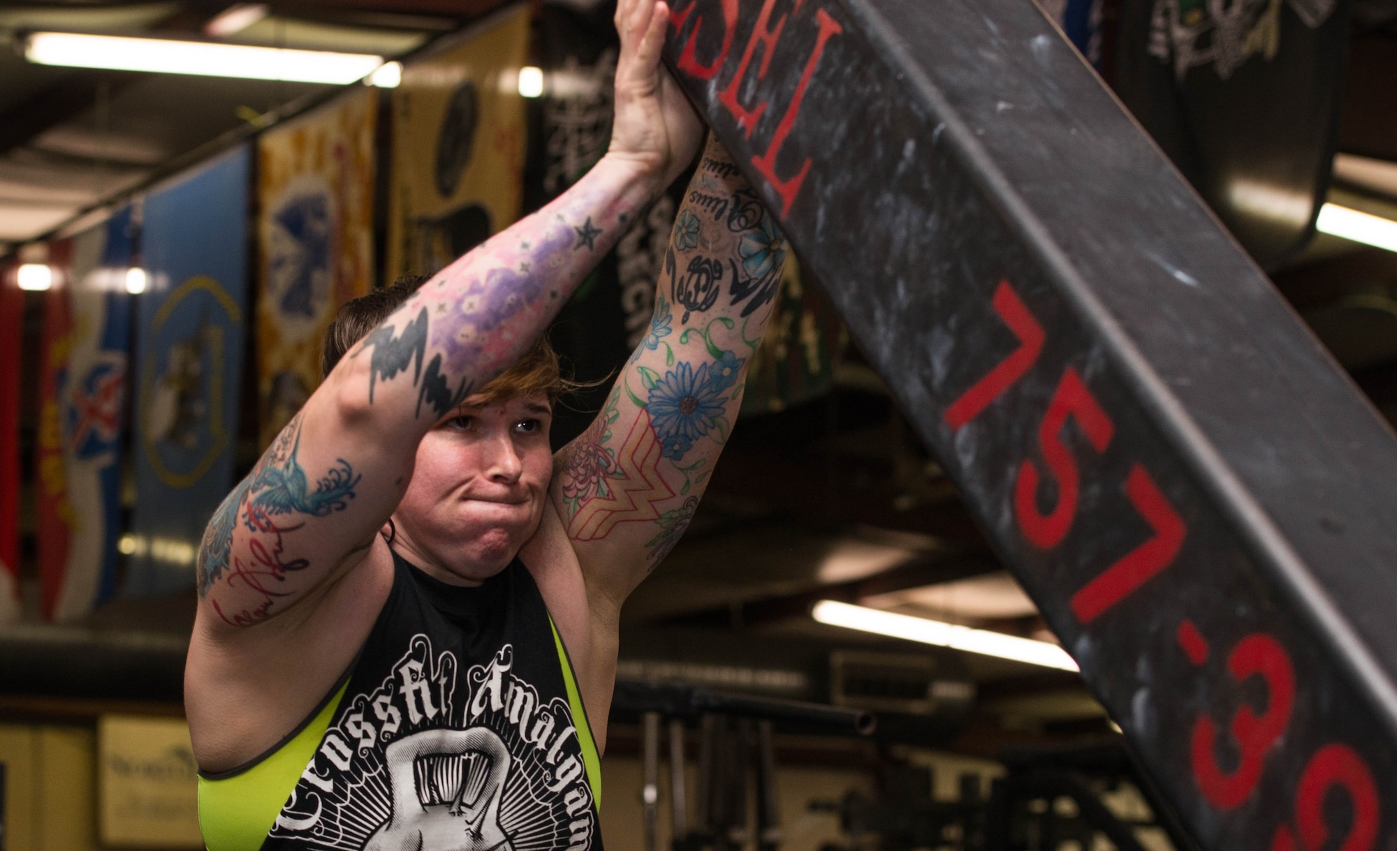 U.S. Army Sgt. 1st Class Stephanie Smith, U.S. Army Aviation Center of Intelligence senior small group leader, performs a clean-and-press 
in preparation for an upcoming strongman competition at Brute Strength Gym in Norfolk, Va., July 23, 2016. Smith has been competing in strongman competitions for about three years, has won two national level competitions and was invited to compete in the world’s event in October 2016. (U.S. Air Force photo by Airman 1st Class Derek Seifert)
