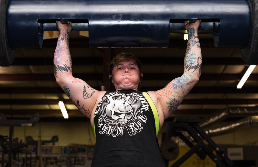 U.S. Army Sgt. 1st Class Stephanie Smith, U.S. Army Aviation Center of Intelligence senior small group leader, performs a log clean-and-press in preparation for an upcoming strongman competition at Brute Strength Gym in Norfolk, Va., July 23, 2016. Smith has competed in two national level competitions and won both for her weight class, which has qualified her for a world’s level event in October. (U.S. Air Force photo by Airman 1st Class Derek Seifert)