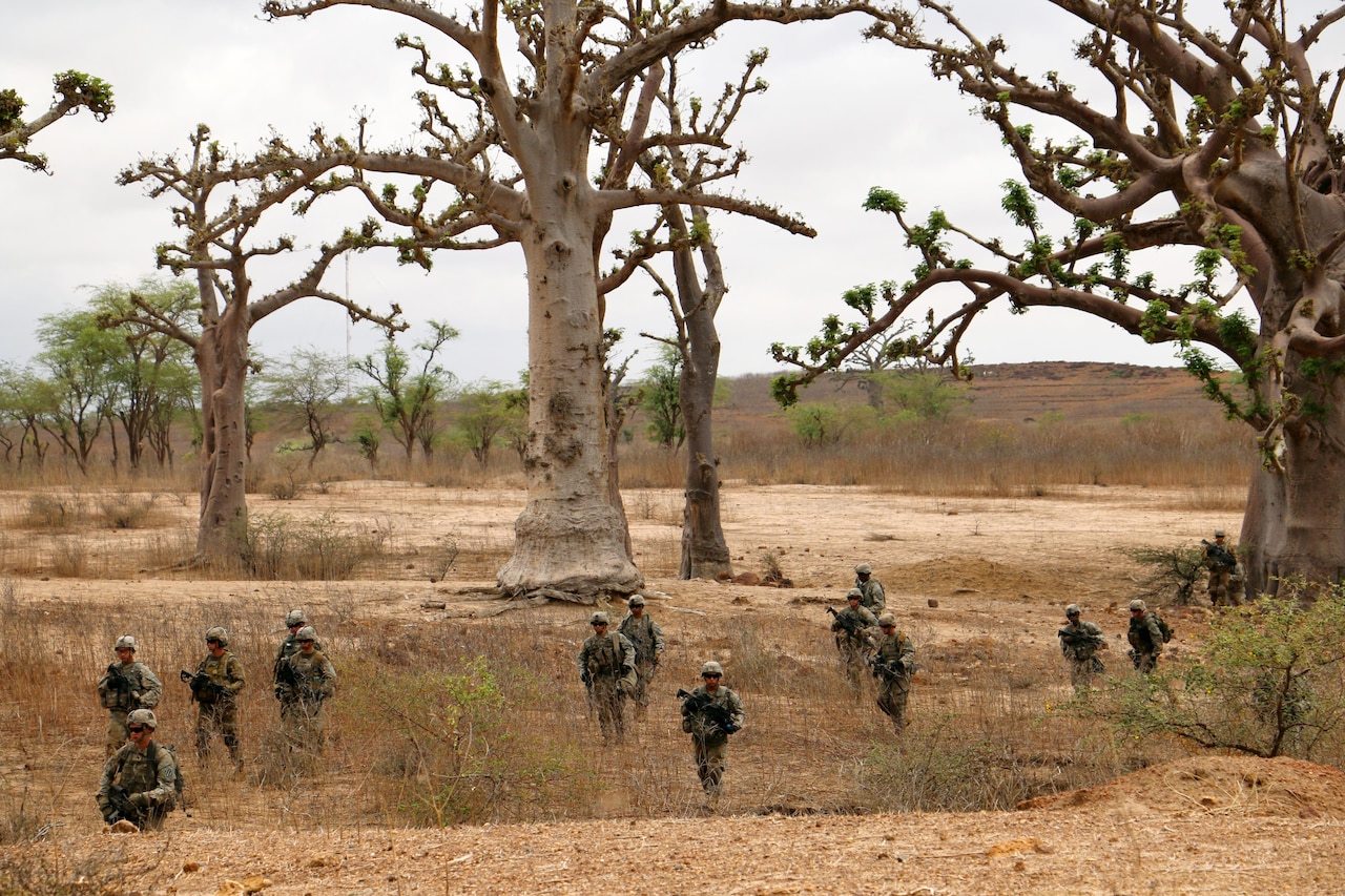 U.S. soldiers with Bravo Company, 1st Battalion, 30th Infantry Regiment, 2nd Infantry Brigade Combat Team, 3rd Infantry Division, traverse rocky terrain to begin a platoon live-fire exercise as part of Africa Readiness Training 16 in Thies, Senegal, July 21, 2016. Army photo by Staff Sgt. Candace Mundt