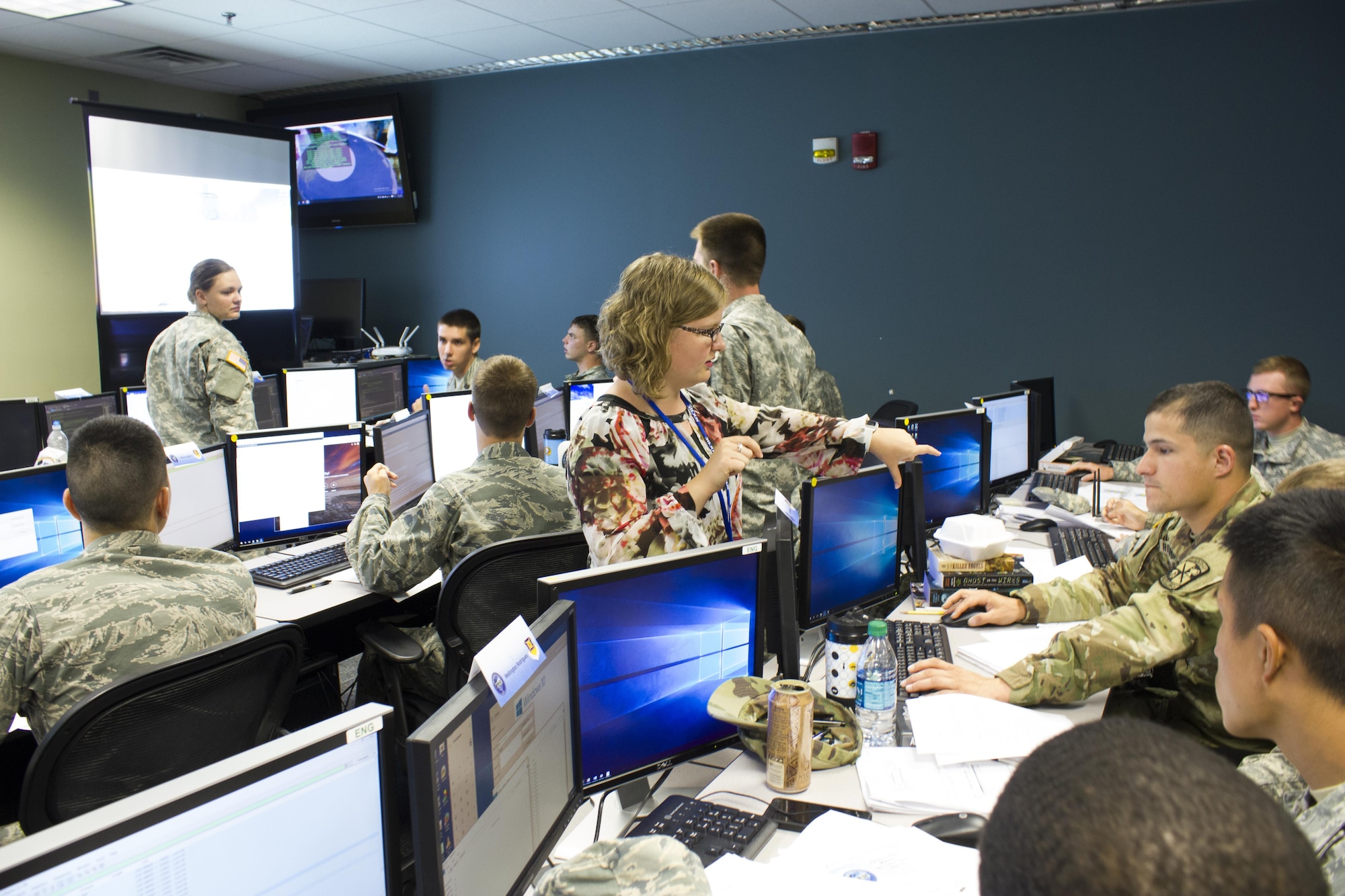 Advance Cyber Education (ACE) program Academy and ROTC cadets participate in a 3-D virtual world-based scenario lab. Kendra graham, AFIT summer intern from Brigham Young University, answered student questions and helped to create the virtual lab scenario that is one of the ACE program hands-on learning experience. The ACE program covers a wide variety of cyber-security related disciplines to develop original thinkers and technical leaders in cyber security. (Contributed photo)