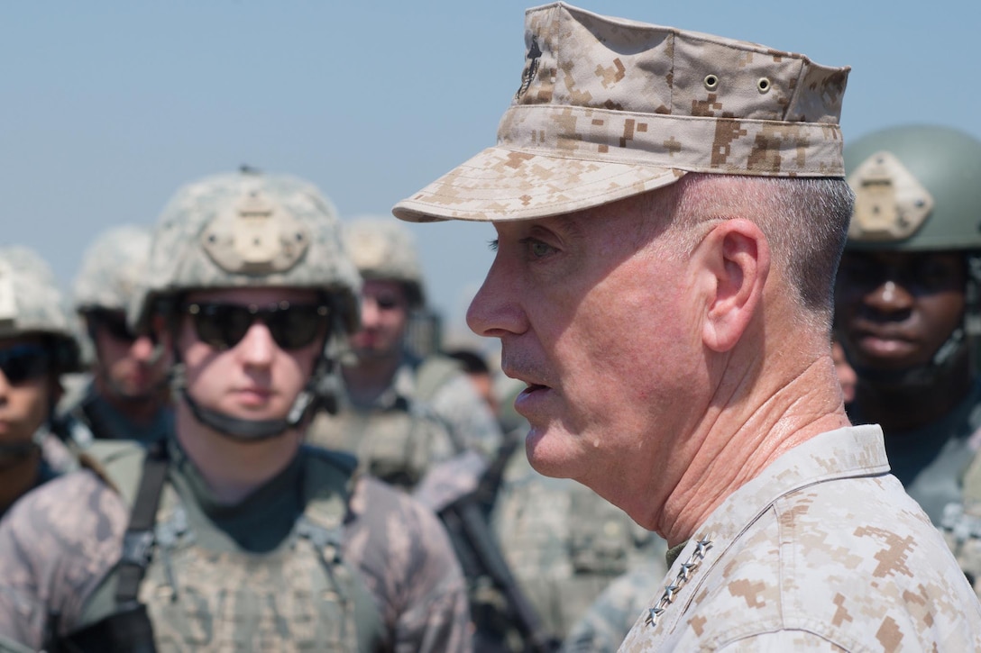 Marine Corps Gen. Joe Dunford, chairman of the Joint Chiefs of Staff, talks to airmen following a field exercise at Incirlik Air Base, Turkey, Aug. 2, 2016. The airmen are assigned to the 39th Security Forces Squadron base defense operations center. DoD photo by Navy Petty Officer 2nd Class Dominique A. Pineiro