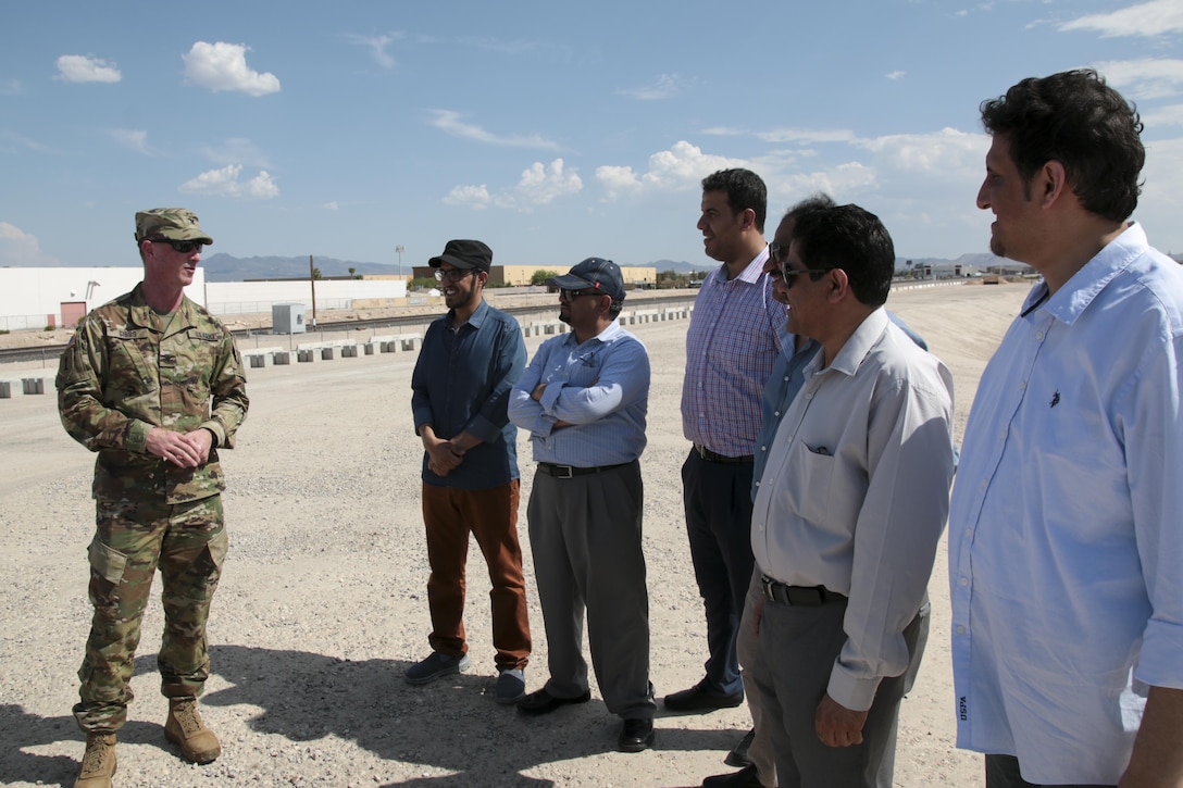 U.S. Army Corps of Engineers Los Angeles District Commander Col. Kirk Gibbs (left) briefs a delegation from Saudi Arabia during a tour of flood risk management projects in Las Vegas July 28. Of particular interest to the group was the District's longtime partnership with the Clark County Regional Flood Control District.