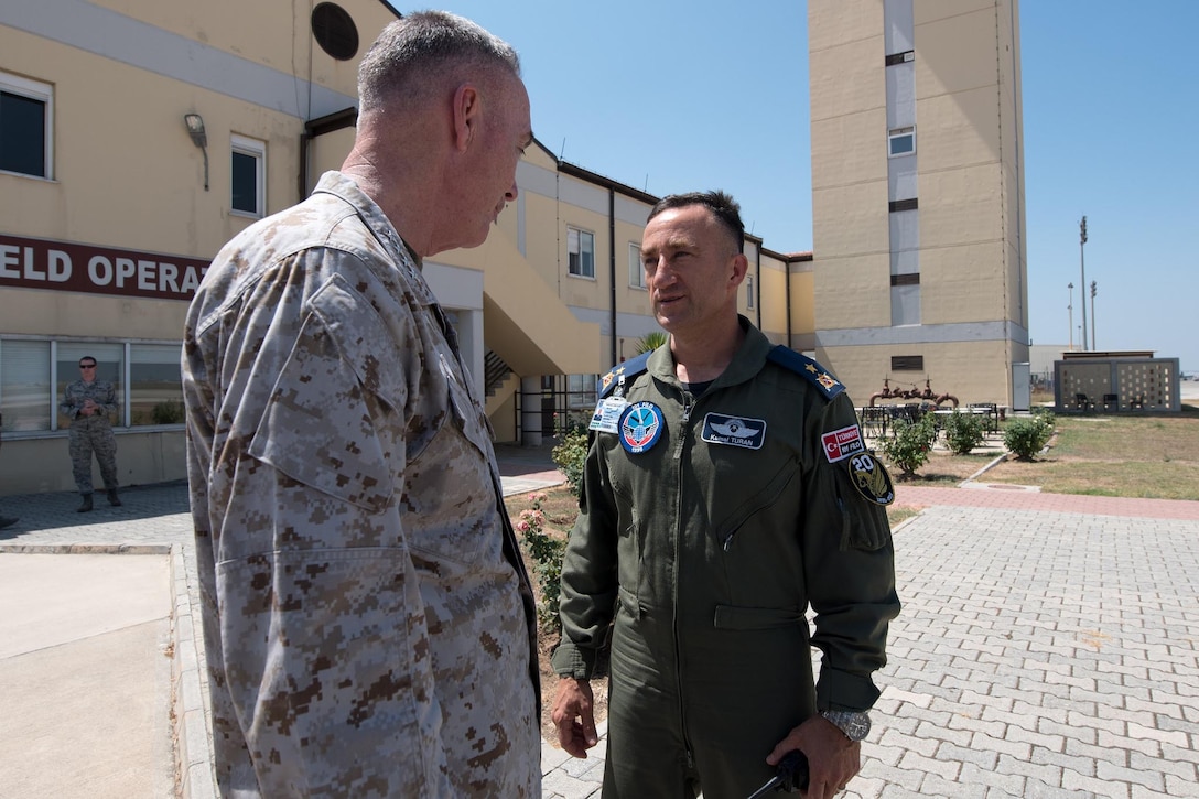 Marine Corps Gen. Joe Dunford, left, chairman of the Joint Chiefs of Staff, speaks with Turkish Air Force Brig. Gen. Kemal Turan before departing Incirlik Air Base, Turkey, Aug. 2, 2016. DoD photo by Navy Petty Officer 2nd Class Dominique A. Pineiro
