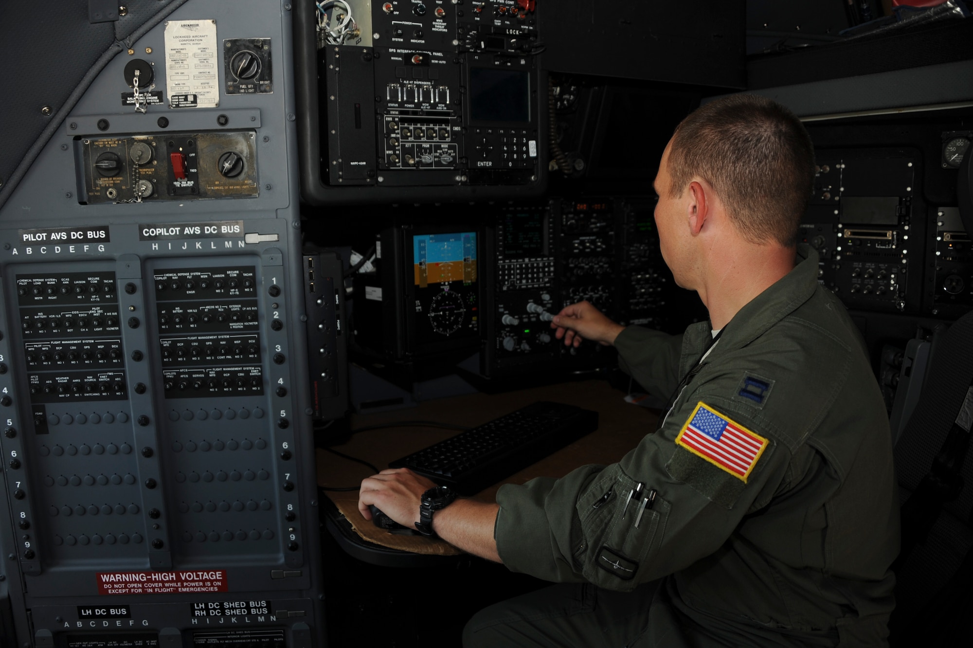 U.S. Air Force Capt. Gregory Jackson, 42nd Electronic Combat Squadron assistant director of operations, demonstrates the upgraded navigation system in an EC-130H Compass Call at Davis-Monthan Air Force Base, Ariz., July 19, 2016. With new radar upgrades provided via an avionic viability program, the EC-130H has improved navigation performance in order to sharpen tactics, techniques and procedures for precision electronic attack. (U.S. Air Force photo by Airman Nathan H. Barbour/Released)