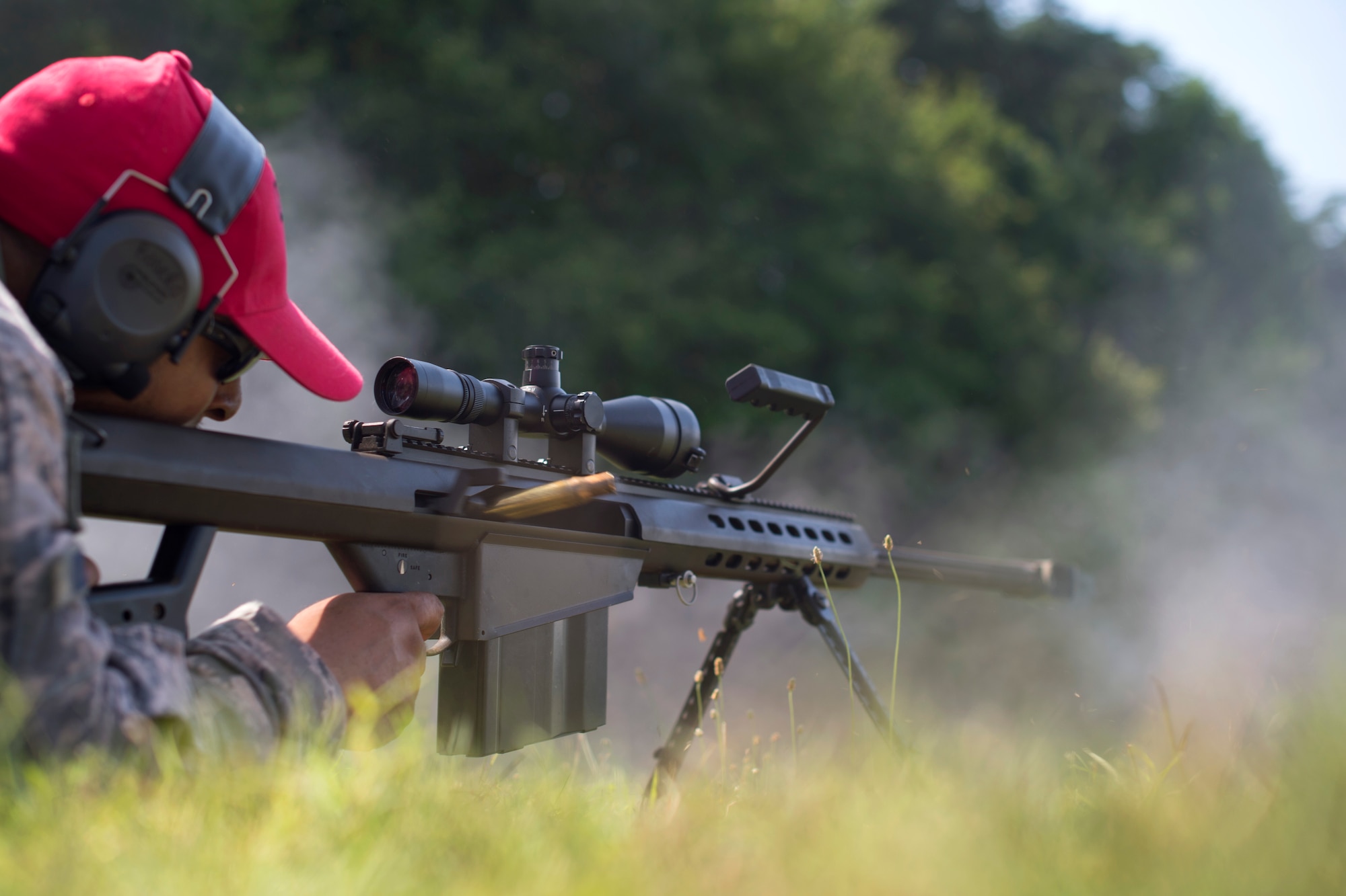 Staff Sgt. Edgardo Rosero, 11th Security Support Squadron Combat Arms instructor, shoots a Barrett M107 rifle at Marine Corps Base Quantico, Va., July 15, 2016. Joint Base Andrews combat arms instructors shot two weapon systems to familiarize themselves with the weapons to instruct other service members requiring sniper training. (U.S. Air Force photo by Airman 1st Class Philip Bryant)