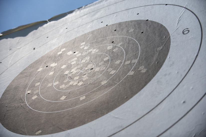 A sniper rifle range target is riddled by rounds from 800 meters during an 11th Security Support Squadron combat arms weapons system training session at Marine Corps Base Quantico, Va., July 15, 2016. Joint Base Andrews combat arms instructors shot two weapon systems to familiarize themselves with the weapons to instruct other service members requiring sniper training. (U.S. Air Force photo by Airman 1st Class Philip Bryant)