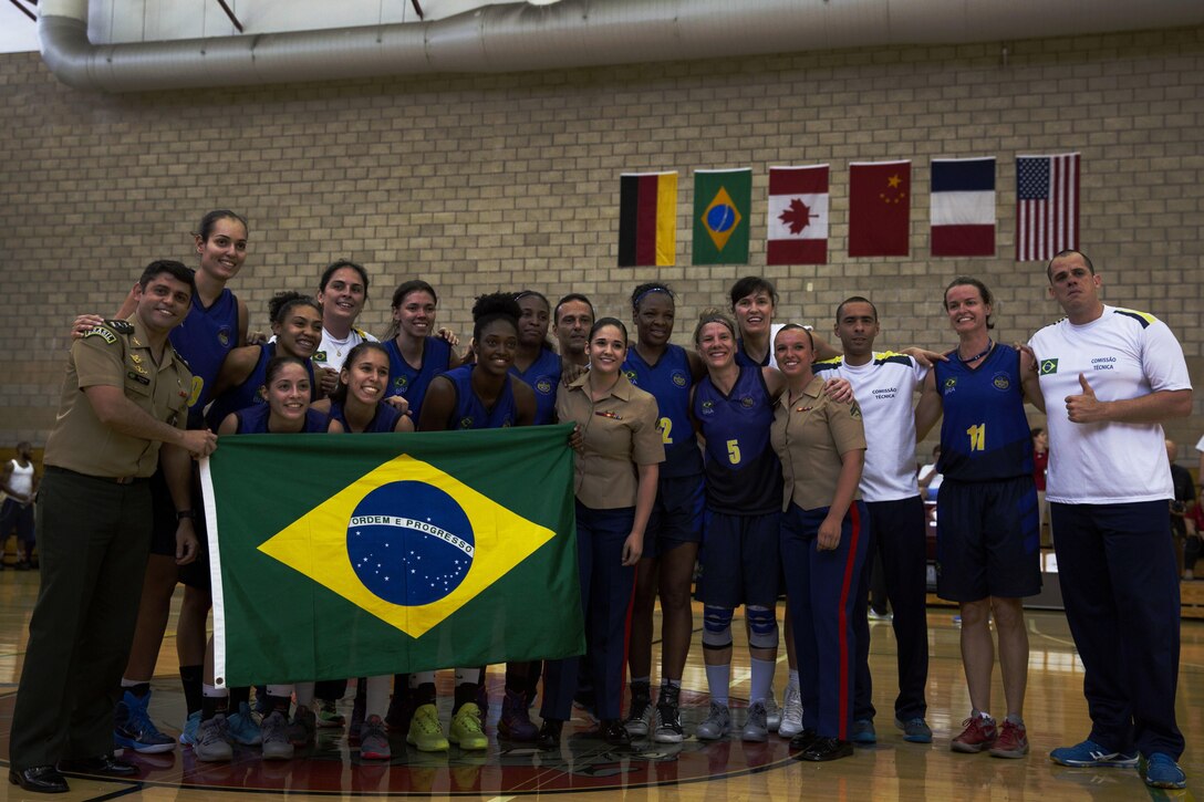 Team Brazil poses for a group picture after winning the final game at the Conseil International Du Sport Militaire (CISM) World Military Women’s Basketball Championship July 29 at Camp Pendleton, California.  The tournament ended July 29, with Brazil winning the last game in the final seconds.  U.S.A took second place, and China will return home with the Bronze. The base hosted the CISM World Military Women’s Basketball Championship July 25 through July 29 to promote peace activities and solidarity among military athletes through sports.  Teams from Canada, France, and Germany also participated (U.S. Marine Corps photo by Sgt. Abbey Perria)
