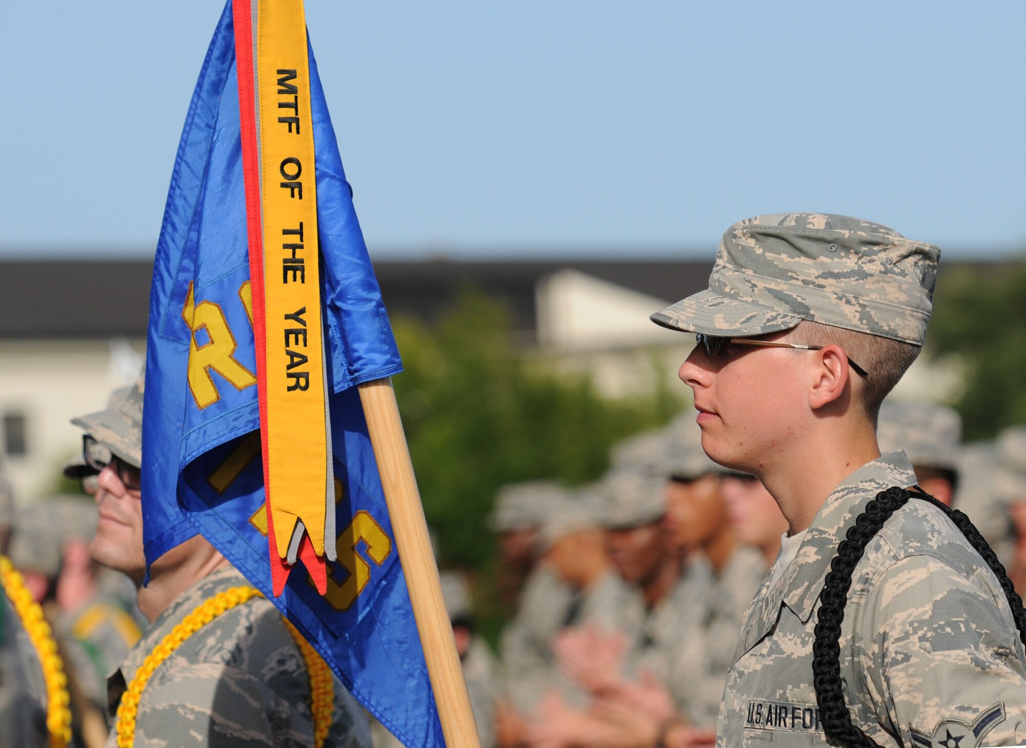 Airman Chase Lovelace, 335th Training Squadron, holds his squadron’s guidon while standing in formation during the 81st Training Group Dragon Recognition Ceremony on the drill pad at the Levitow Training Support Facility July 28, 2016, on Keesler Air Force Base, Miss. The 335th TRS was awarded the Military Training Flight of the Month. The monthly event also recognized the Airman of the Month, the 2016 second quarter Military Training Flight and Military Training Leader Dragon Award winners as well as Airmen promotees. (U.S. Air Force photo by Kemberly Groue/Released)