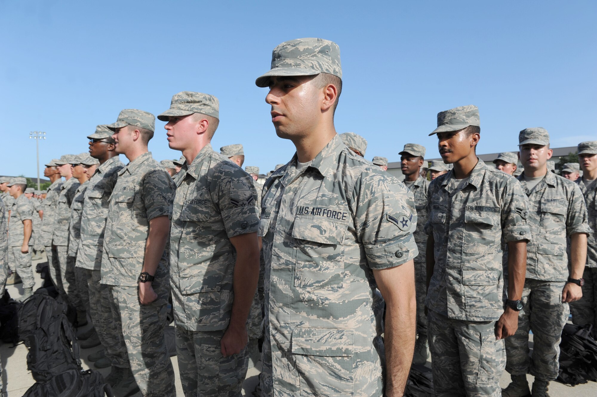 Airmen from the 81st Training Group stand in formation during the 81st TRG Dragon Recognition Ceremony on the drill pad at the Levitow Training Support Facility July 28, 2016, on Keesler Air Force Base, Miss. The monthly event recognized the Airman of the Month for June, the 2016 second quarter Military Training Flight of the Month and Military Training Leader Dragon Award winner as well as Airmen promotees. (U.S. Air Force photo by Kemberly Groue/Released)