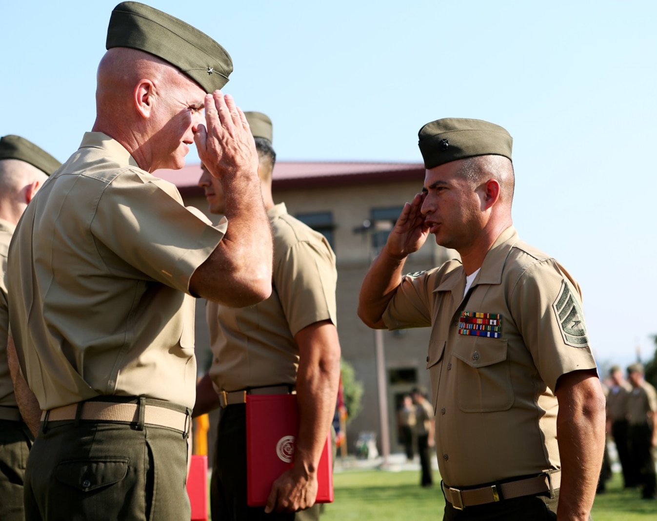 U.S. Marine Gunnery Sgt. Pablo Hernandez renders a salute to Brig. Gen. David A. Ottignon at the 1st Marine Logistics Group quarterly awards ceremony aboard Camp Pendleton Calif., July 29, 2016. Ottignon is the 1st MLG commanding general and Hernandez is an operations chief at 7th Engineer Support Battalion. Hernandez was one of the Marines recognized at the ceremony for their outstanding achievements in the performance of their duties for the fiscal year 2016 third quarter. (U.S. Marine Corps photo by Sgt. Carson Gramley/released)