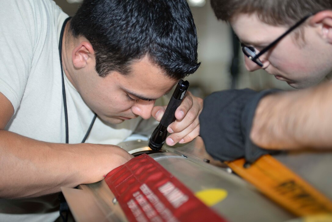 Staff Sgt. Anthony Anderson, a conventional maintenance crew chief and munitions inspector assigned to the 28th Munitions Squadron, inspects an MK 62 quick strike mine at Ellsworth Air Force Base (AFB), S.D., July 20, 2016. Anderson’s job consists of making munitions in a timely manner, as well as overseeing the quality of munitions being produced by other Airmen. (U.S. Air Force photo by Airman 1st Class Sadie Colbert)