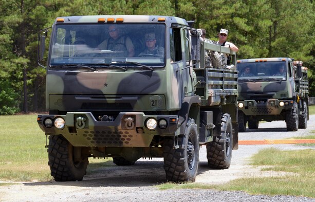 Chaplain candidates drive and ride in an M1078 light medium tactical vehicle at Robins Air Force Base, Ga, July 25. The candidates are participants in the Air Force Reserve Command Chaplain Candidate Intensive Interview program which aims to provide an extensive overview of the Air Force Reserve mission and military chaplain corps.(U.S. Air Force photo/Tech. Sgt. Kelly Goonan)