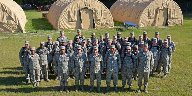 Chaplain candidates and cadre take a moment to pose for a photo at Robins Air Force Base, Georgia, July 25. The candidates are participants in the Air Force Reserve Command Chaplain Candidate Intensive Interview program which aims to provide an extensive overview of the Air Force Reserve mission and military chaplain corps.(U.S. Air Force photo/Tech. Sgt. Kelly Goonan)