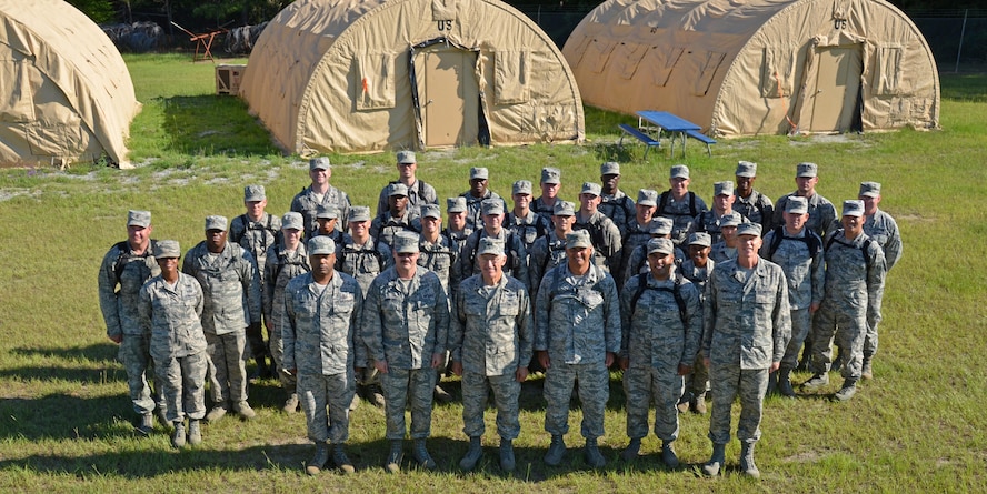 Chaplain candidates and cadre take a moment to pose for a photo at Robins Air Force Base, Georgia, July 25. The candidates are participants in the Air Force Reserve Command Chaplain Candidate Intensive Interview program which aims to provide an extensive overview of the Air Force Reserve mission and military chaplain corps.(U.S. Air Force photo/Tech. Sgt. Kelly Goonan)