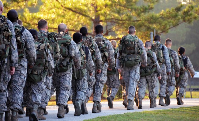 The chaplain candidates return from a 2.8 mile ruck march at Robins Air Force Base, Georgia, July 25. The candidates are participants in the Air Force Reserve Command Chaplain Candidate Intensive Interview program which aims to provide an extensive overview of what the Air Force Reserve mission is as well as a broad overview of the military chaplain corps.(U.S. Air Force photo/Tech. Sgt. Kelly Goonan)
