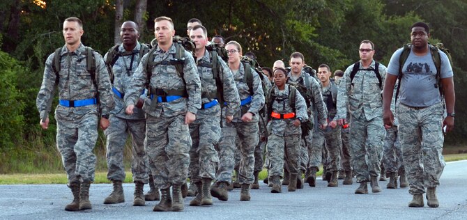 2nd Lt. Caleb Walker and 2nd Lt. David Edwards, chaplain candidates, lead the rest of the candidates on a 2.8 mile ruck march while Chaplain (Maj.) Stacey Hanson, 94th Airlift Wing, and an Instructor from the 5th Combat Communications Squadron Support, march along side them at Robins Air Force Base, Georgia, July 25. The candidates are participants in the Air Force Reserve Command Chaplain Candidate Intensive Interview program which aims to provide an extensive overview of the Air Force Reserve mission and military chaplain corps.(U.S. Air Force photo/Tech. Sgt. Kelly Goonan)