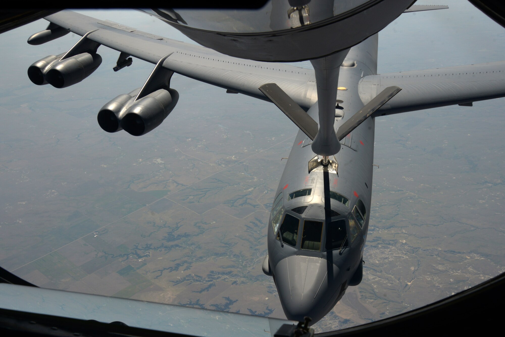 A KC-135 Stratotanker refuels a B-52 Stratofortress, above Minnesota, July 31, 2016. Four of McConnell's KC-135s assisted in refueling two B-52s to reach Polar Roar. Polar Roar is a mission in the Arctic Circle that demonstrates the ability to provide a flexible and vigilant long-range global-strike capability. (U.S. Air Force photo/Airman 1st Class Christopher Thornbury)