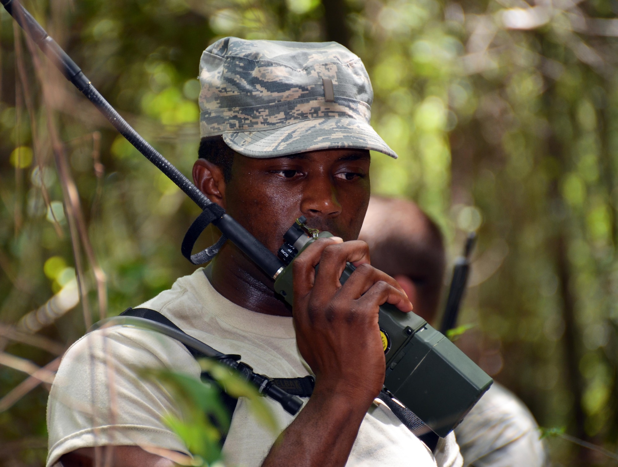 2nd Lt. Timothy Jones II, Chaplain Candidate, radios in his teams location and requests permission to continue onto their next location for land navigation training at Robins Air Force Base, Georgia, July 25, 2016. The candidates are participating in the Air Force Reserve Command Chaplain Candidate Intensive Interview program which aims to provide an extensive overview of what the Air Force Reserve mission is as well as a broad overview of the military chaplain corps. During the last week of the program, the candidates were immersed in fast-paced mobility training conducted by active-duty instructors from the 5th Combat Communications Squadron Support. (U.S. Air Force photo/Tech. Sgt. Kelly Goonan)