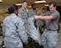 Instructor Staff Sgt. Kurtis Fisher, 5th Combat Communications Squadron Support, hands 2nd Lieutenant Jasmin Luck a Kevlar vest at Robins Air Force Base, Georgia, July 25, 2016. The candidates are participating in the Air Force Reserve Command Chaplain Candidate Intensive Interview program which aims to provide an extensive overview of what the Air Force Reserve mission is as well as a broad overview of the military chaplain corps. During the last week of the program, the candidates were immersed in fast-paced mobility training conducted by active-duty instructors from the 5th Combat Communications Squadron Support. (U.S. Air Force photo/Tech. Sgt. Kelly Goonan)