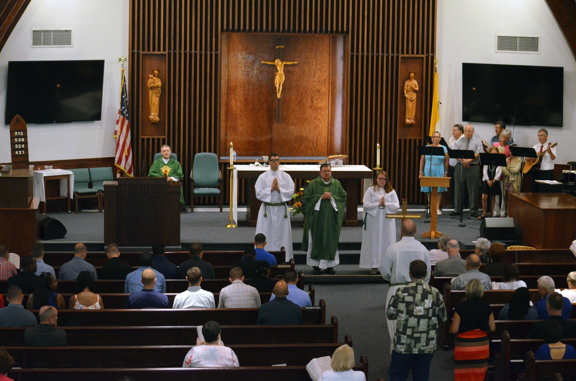 Chaplain candidates and members of the Catholic church attend Sunday morning worship in the base chapel at Robins Air Force Base, Georgia, July 25, 2016. The candidates are participating in the Air Force Reserve Command Chaplain Candidate Intensive Interview program which aims to provide an extensive overview of what the Air Force Reserve mission is as well as a broad overview of the military chaplain corps. During the last week of the AFRC program, the candidates were immersed in fast-paced mobility training conducted by active-duty instructors from the 5th Combat Communications Squadron Support. (U.S. Air Force photo/Tech. Sgt. Kelly Goonan)