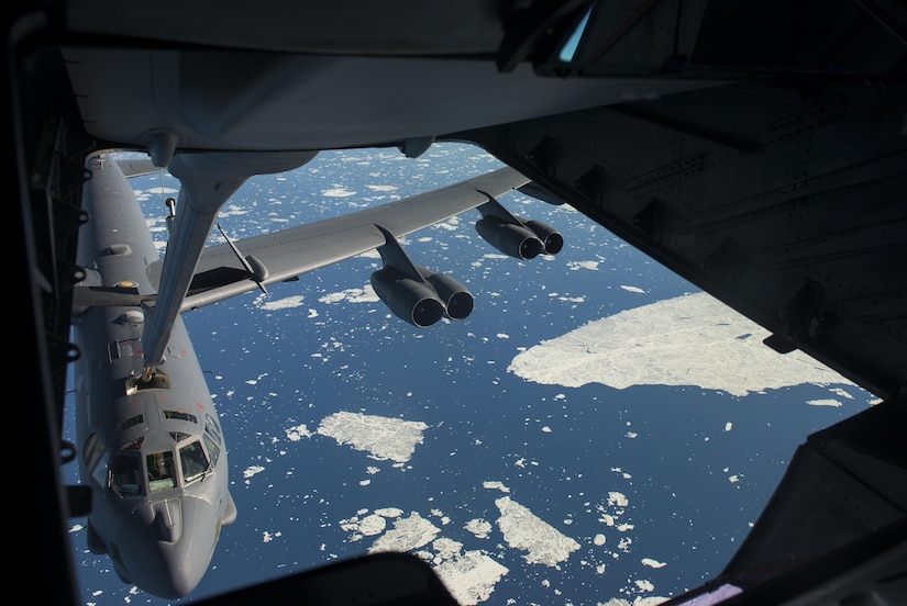 A B-52 Stratofortress from Minot Air Force Base, N.D. receives fuel from a 305th Air Mobility Wing, Joint Base McGuire-Dix-Lakehurst, N.J. during Polar Roar, a strategic deterrence exercise, in the skies near the North Pole, July 31. The B-52 received 70 thousand pounds of fuel from the KC-10 during the refueling. 
