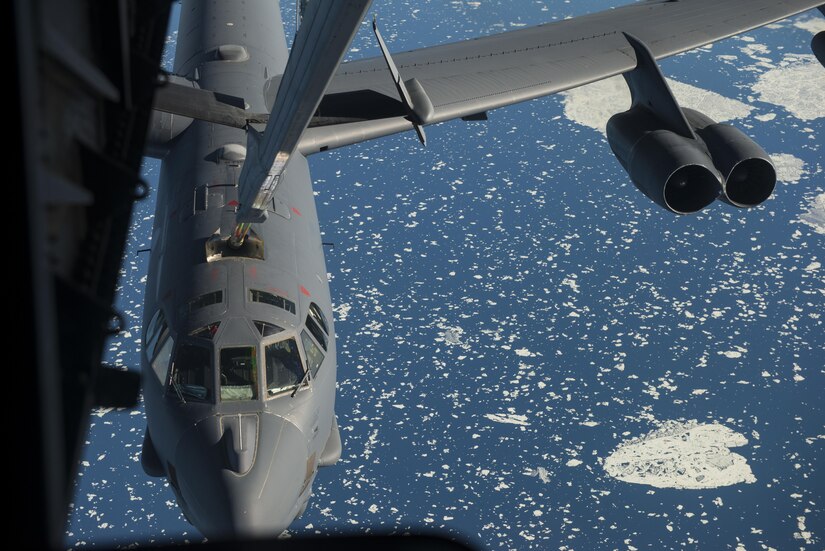 A B-52 Stratofortress from Minot Air Force Base, N.D. receives fuel from a 305th Air Mobility Wing, Joint Base McGuire-Dix-Lakehurst, N.J. during Polar Roar, a strategic deterrence exercise, in the skies near the North Pole, July 31. Three B-52’s received fuel from four KC-10’s and continued on with their mission. 
