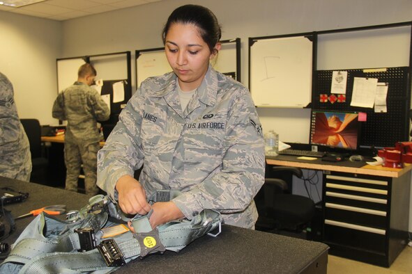 Airman 1st Class Katarina Milanes, 57th Weapons Support Squadron, aircrew flight equipment journeyman, checks a harness for an F-16 pilot at Nellis Air Force Base, Nev., June 13, 2016. The 57 WPSS AFE section maintains life-preserving equipment for multiple airframes, ensuring crew members return home safely. (U.S. Air Force photo by Susan Garcia)


