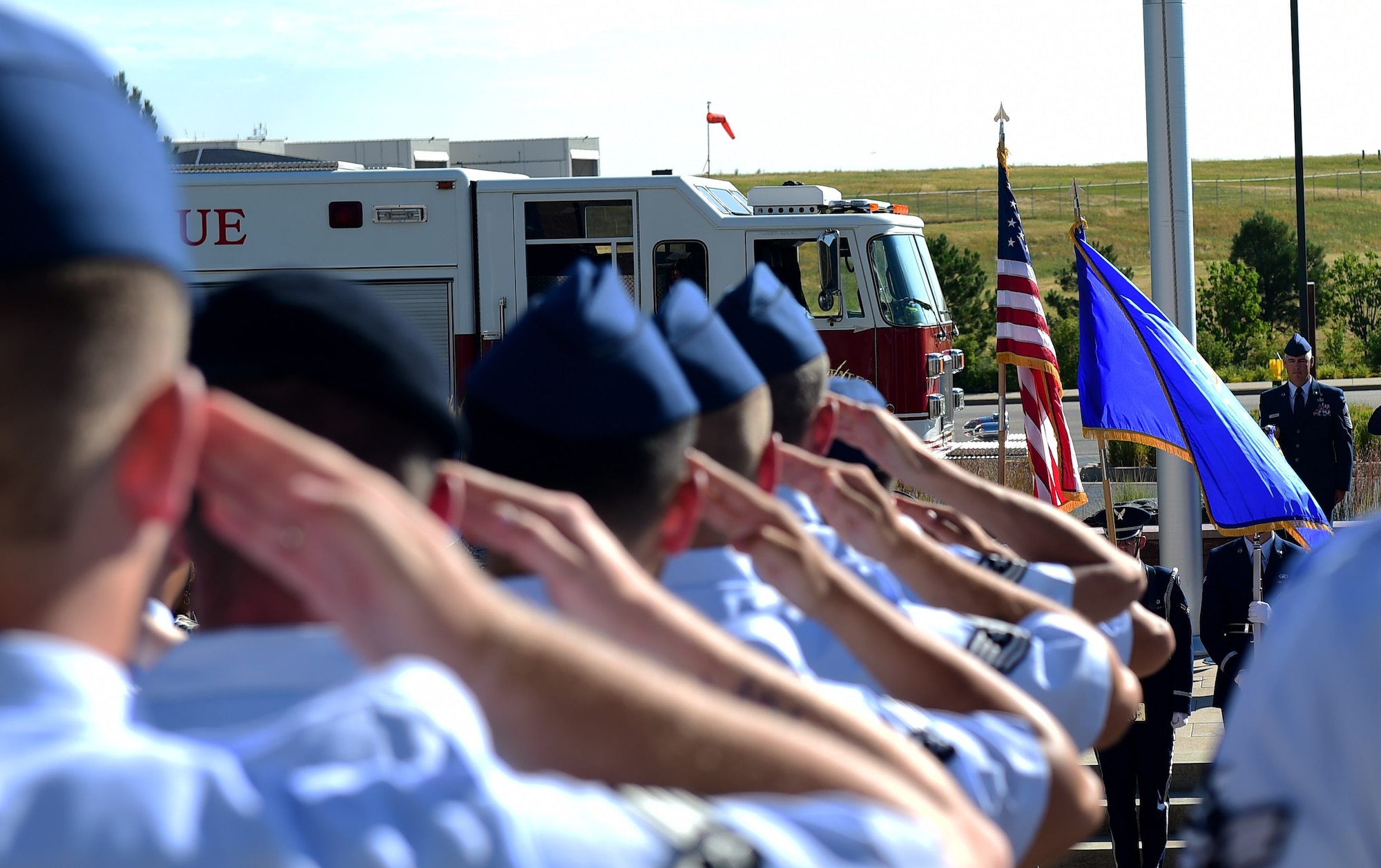 Members of the 460th Mission Support Group salute the American flag August 1, 2016, during the MSG change of command on Buckley Air Force Base, Colo. A change of command ceremony represents the formal transfer of responsibility from an outgoing commander to their successor. (U.S. Air Force photo by Airman 1st Class Gabrielle Spradling/Released) 