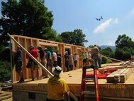 The Mountain Outreach team builds a home for a family in need.