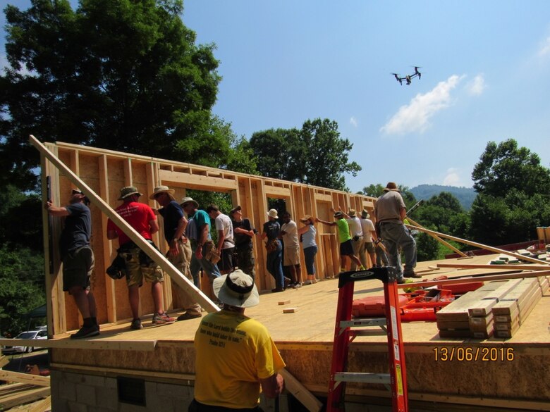 The Mountain Outreach team builds a home for a family in need.